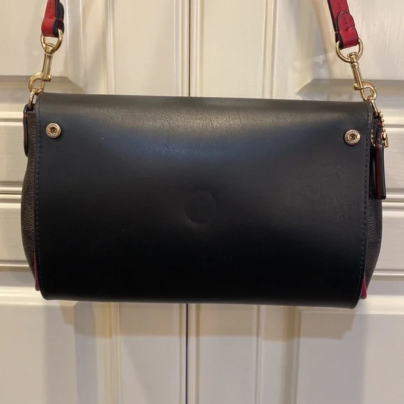 This is a like new coach cross body bag. - Picture 2 of 9